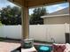 Relaxing screened-in patio with comfortable seating and view of the backyard at 12728 Boggy Pointe Dr, Orlando, FL 32824