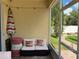 Cozy screened-in patio with comfortable seating and umbrella at 12728 Boggy Pointe Dr, Orlando, FL 32824