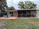 The backyard features a grill, patio, and fenced in yard at 1310 Briarwood Ave, Deltona, FL 32725