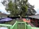 Overview of the backyard with mature trees, a patio, seating and above ground pool, perfect for outdoor living at 1310 Briarwood Ave, Deltona, FL 32725