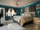 Large bedroom with a ceiling fan, decorative curtains, and space for king size bed at 1310 Briarwood Ave, Deltona, FL 32725