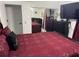 This bedroom features a bed with a red cover and a mirrored closet at 1310 Briarwood Ave, Deltona, FL 32725