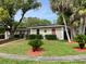 A well-maintained home with manicured lawn, trimmed hedges, and colorful accent landscaping at 1310 Briarwood Ave, Deltona, FL 32725