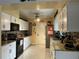 Well-appointed kitchen with white cabinets, granite countertops, and modern appliances at 1310 Briarwood Ave, Deltona, FL 32725