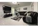 Inviting living room with a large TV and comfortable seating area at 1310 Briarwood Ave, Deltona, FL 32725