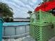 Above ground pool with colorful umbrellas and green deck. Great space for relaxation and enjoyment at 1310 Briarwood Ave, Deltona, FL 32725