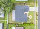 Aerial view of a single-story home with fenced yard, mature trees, and well-maintained landscaping at 1322 Ravida Woods Dr, Apopka, FL 32703