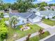 Bird's eye view of a well-maintained single-story home with a two-car garage and lush landscaping at 1322 Ravida Woods Dr, Apopka, FL 32703