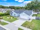 Beautiful single-story home with a well-kept lawn, mature trees, and a two-car garage at 1322 Ravida Woods Dr, Apopka, FL 32703