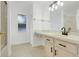 Bathroom with a large mirror, updated vanity and shower with glass door at 1322 Ravida Woods Dr, Apopka, FL 32703