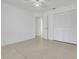Bedroom with tile flooring, ceiling fan, and a closet with folding doors at 1322 Ravida Woods Dr, Apopka, FL 32703