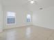 Spacious bedroom with tile floors and a ceiling fan with a light at 1322 Ravida Woods Dr, Apopka, FL 32703