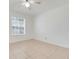 Bright bedroom with tile floors, ceiling fan, and a window with blinds at 1322 Ravida Woods Dr, Apopka, FL 32703