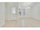 Bright foyer with tile flooring, front door, and natural light, perfect for welcoming guests at 1322 Ravida Woods Dr, Apopka, FL 32703