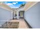 Charming front entry with a tiled walkway and decorative plants, leading to a bright and welcoming home at 1322 Ravida Woods Dr, Apopka, FL 32703