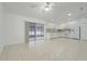 Open-concept kitchen with white cabinets, appliances, and breakfast bar seating area at 1322 Ravida Woods Dr, Apopka, FL 32703