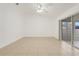 Bright living room with tile floors and sliding glass doors to screened porch at 1322 Ravida Woods Dr, Apopka, FL 32703