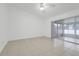 Bright living room with tile floors and sliding glass doors to screened porch at 1322 Ravida Woods Dr, Apopka, FL 32703