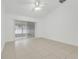 Bright living room with tile floors and sliding glass doors to screened porch at 1322 Ravida Woods Dr, Apopka, FL 32703