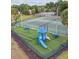 Community playground with swings, slide, and tennis courts offers outdoor enjoyment at 1322 Ravida Woods Dr, Apopka, FL 32703