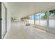 Bright sunroom features tiled flooring, multiple windows and screens, and is well-lit by natural light at 1322 Ravida Woods Dr, Apopka, FL 32703