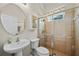 Bathroom with a walk-in shower, a toilet, and a vanity with a round mirror at 13838 Bluebird Park Rd, Windermere, FL 34786