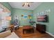 Comfortable bedroom with hardwood floors, a lounge chair, and entertainment center at 13838 Bluebird Park Rd, Windermere, FL 34786