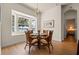 Cozy dining area with a bay window offering scenic water views, creating a serene dining experience at 13838 Bluebird Park Rd, Windermere, FL 34786