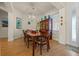 Cozy dining room with a table set for a meal, complemented by a china cabinet at 13838 Bluebird Park Rd, Windermere, FL 34786