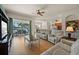 Bright and open living room with sliding glass doors to a patio, connecting indoor and outdoor living spaces at 13838 Bluebird Park Rd, Windermere, FL 34786