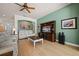 Relaxing living room with a large entertainment center, ample seating, and seamless access to other living spaces at 13838 Bluebird Park Rd, Windermere, FL 34786