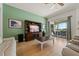Spacious living room with a view of the patio and pool, creating an inviting atmosphere at 13838 Bluebird Park Rd, Windermere, FL 34786