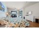 Comfortable main bedroom with large windows, a sitting area, and access to the outdoor pool area at 13838 Bluebird Park Rd, Windermere, FL 34786