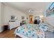 Bright main bedroom features a ceiling fan, wood floors, and a spacious layout at 13838 Bluebird Park Rd, Windermere, FL 34786
