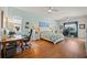 The main bedroom has dual desk areas, ceiling fans, and a large picture window at 13838 Bluebird Park Rd, Windermere, FL 34786