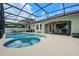 Screened pool with spa, outdoor dining area, and ample seating for relaxing and entertaining at 13838 Bluebird Park Rd, Windermere, FL 34786