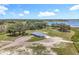 Picturesque aerial view of the property, highlighting its lush greenery and waterfront location at 14243 County Road 450, Umatilla, FL 32784