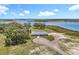 Overhead aerial view of the unique property and its proximity to a beautiful, expansive lake at 14243 County Road 450, Umatilla, FL 32784