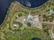 Unique overhead aerial view of the property's location, surrounded by lush landscape and a tranquil lake at 14243 County Road 450, Umatilla, FL 32784
