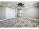 Bedroom with wood-look tile flooring and access to an en suite bathroom at 14243 County Road 450, Umatilla, FL 32784