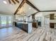 Spacious kitchen featuring granite counters, two islands, stainless appliances, and dark wood accents at 14243 County Road 450, Umatilla, FL 32784