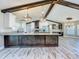 Modern kitchen with a large island, granite countertops, and stainless steel appliances at 14243 County Road 450, Umatilla, FL 32784