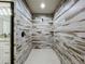 Modern shower with a rainfall showerhead and white tiles at 14243 County Road 450, Umatilla, FL 32784