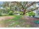 Expansive backyard featuring mature trees and a storage shed at 1506 S Elliott St, Sanford, FL 32771