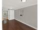 Bedroom with dark wood floors, built in shelving and lots of natural light at 1506 S Elliott St, Sanford, FL 32771