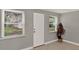 Entryway featuring tiled floors, neutral paint, and windows providing natural light at 1506 S Elliott St, Sanford, FL 32771