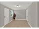 Entryway featuring tiled floors, neutral paint, a window, and a white door at 1506 S Elliott St, Sanford, FL 32771