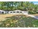 Charming single-story home with a well-maintained lawn, green shutters, and a one-car garage at 1506 S Elliott St, Sanford, FL 32771