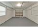 Spacious garage with a large overhead door and painted floor at 1506 S Elliott St, Sanford, FL 32771