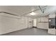 Large, partially finished garage space with cabinets, utility hook-ups, and access door at 1506 S Elliott St, Sanford, FL 32771